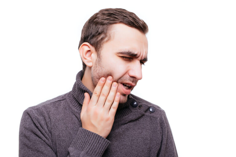 Man with jaw pain from a TMJ disorder
