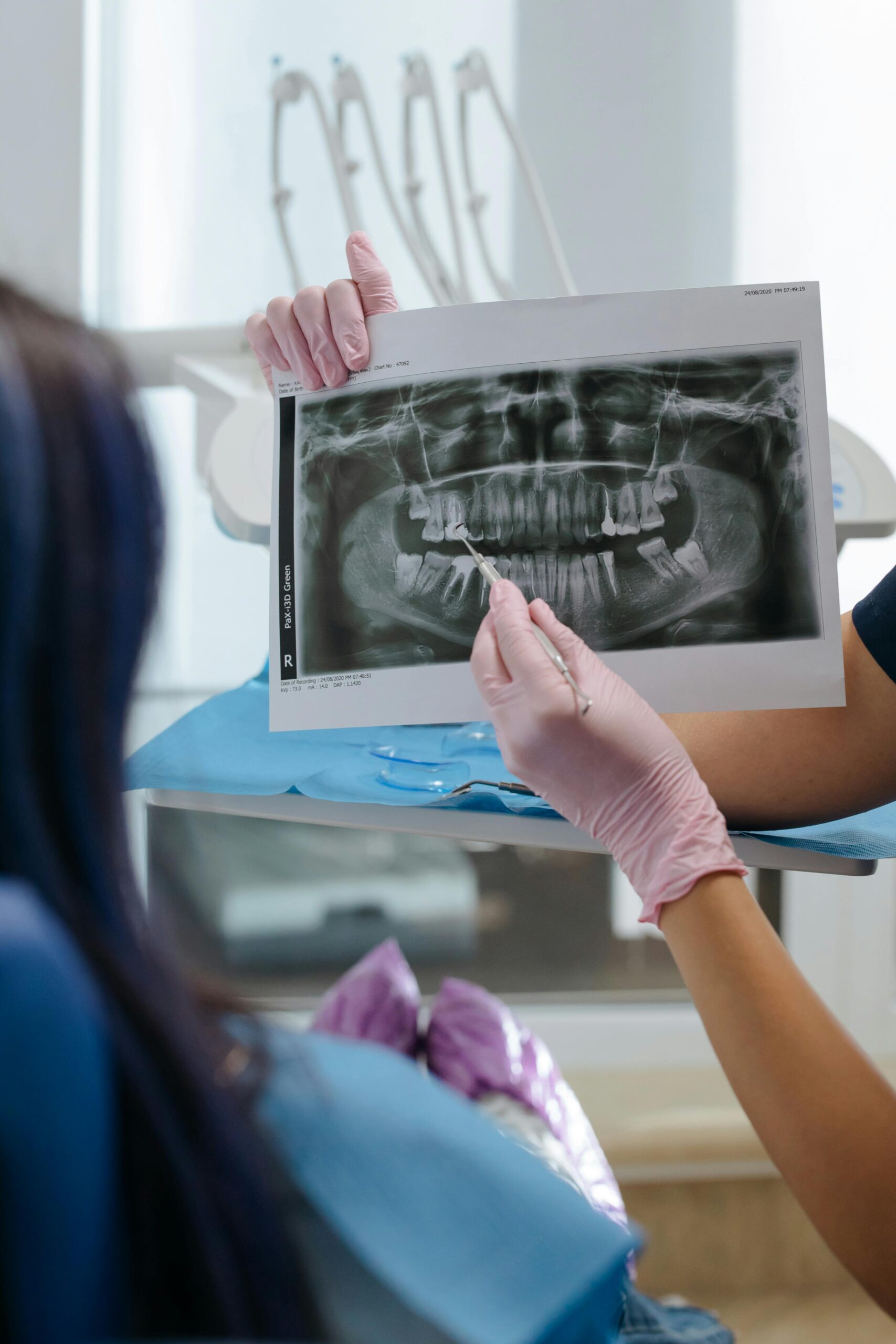 Dentist reviewing a dental X-ray